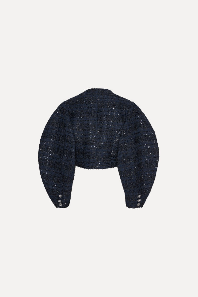 Verkürzte Jacke aus Boucle mit Paillettenbesatz und Ballonärmel von hinten.